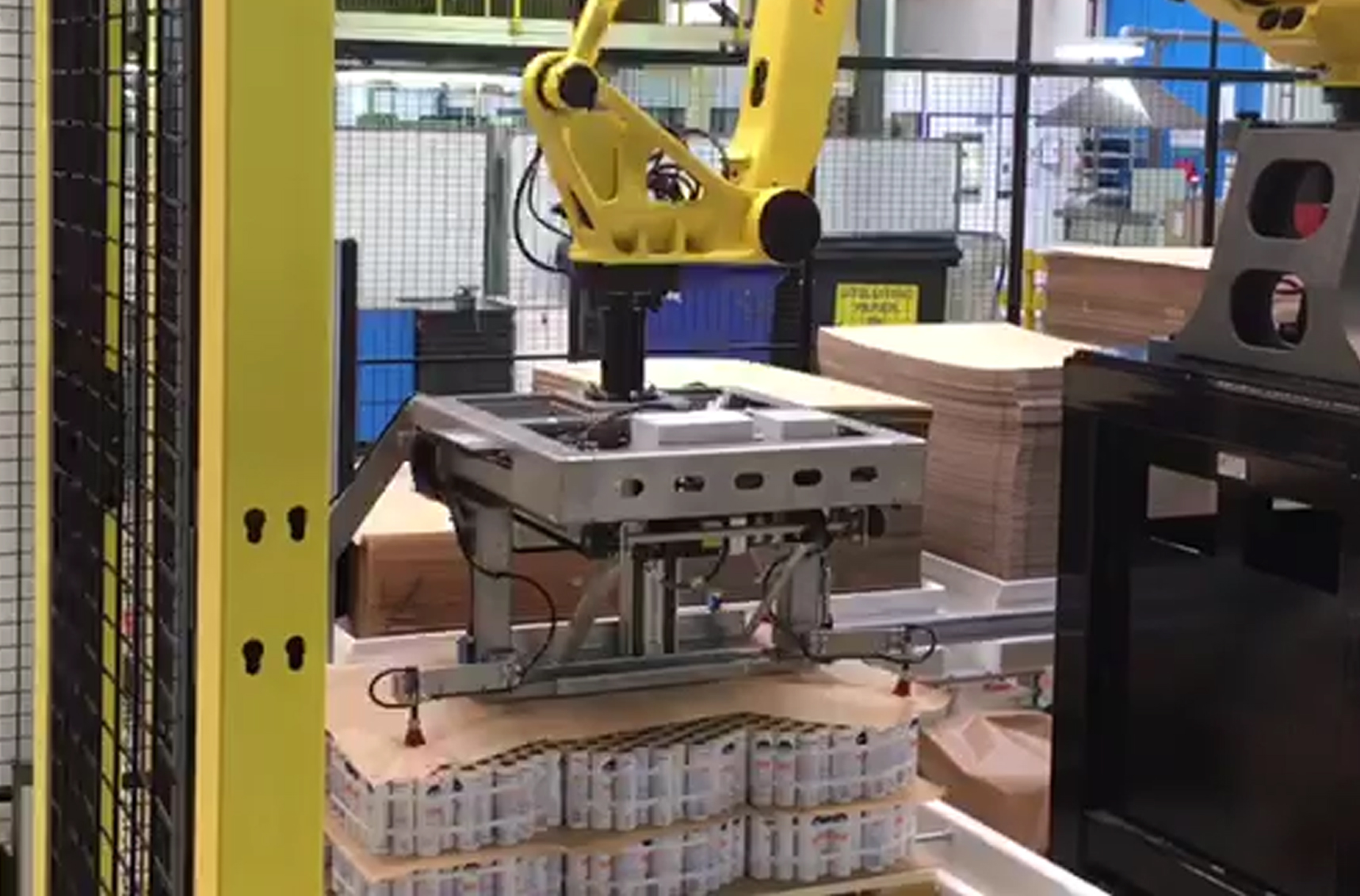 Multifunctional robot gripper for bundled aluminum aerosols and slip sheets